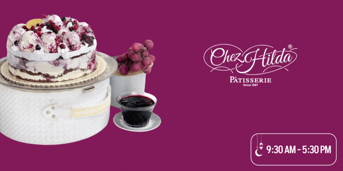 An mixed berry ice-cream cake from Chez Hilda Patisserie with the Ramadan working hours in the bottom right